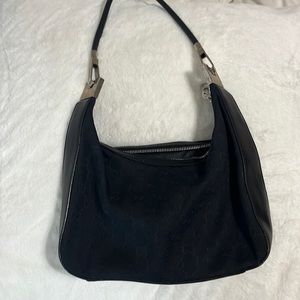 Black handbag- no idea if authentic designer!